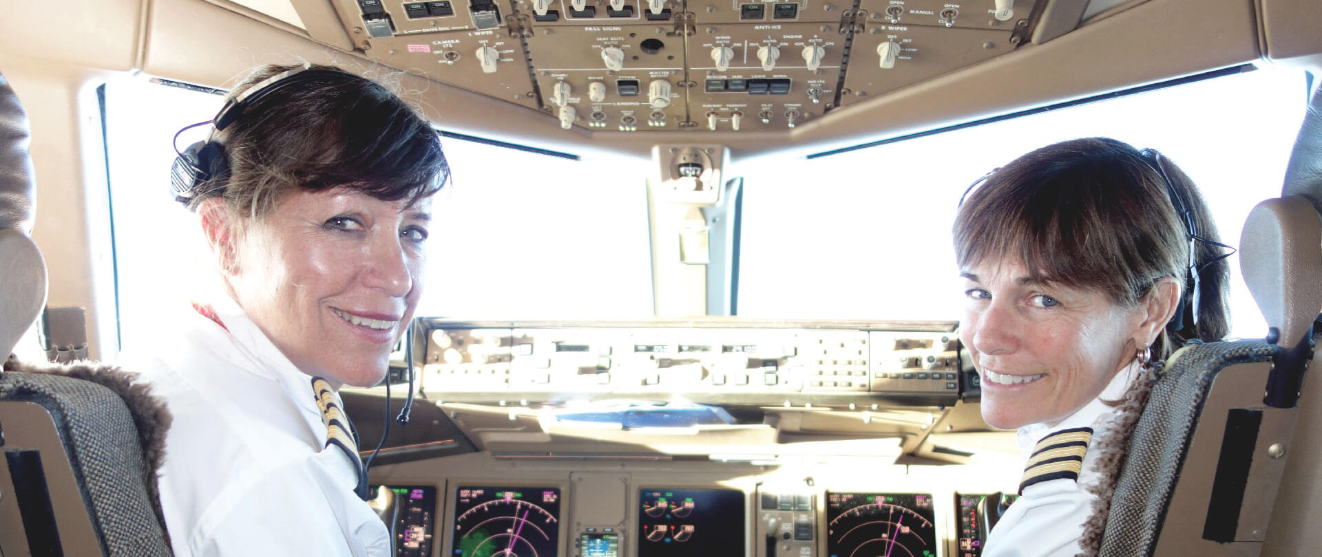 NLAF-CoPilots-Header Women pilots in airplane cockpit